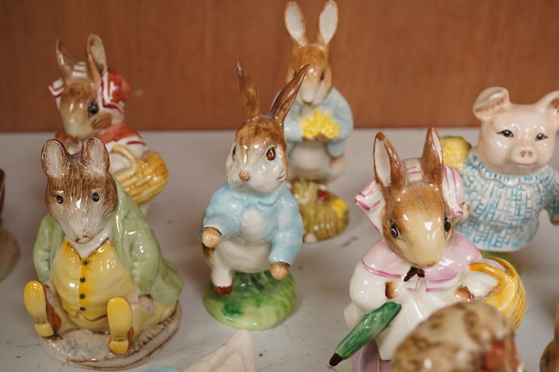 Twenty Beatrix Potter figures, mostly later production figures, largest 11cm high